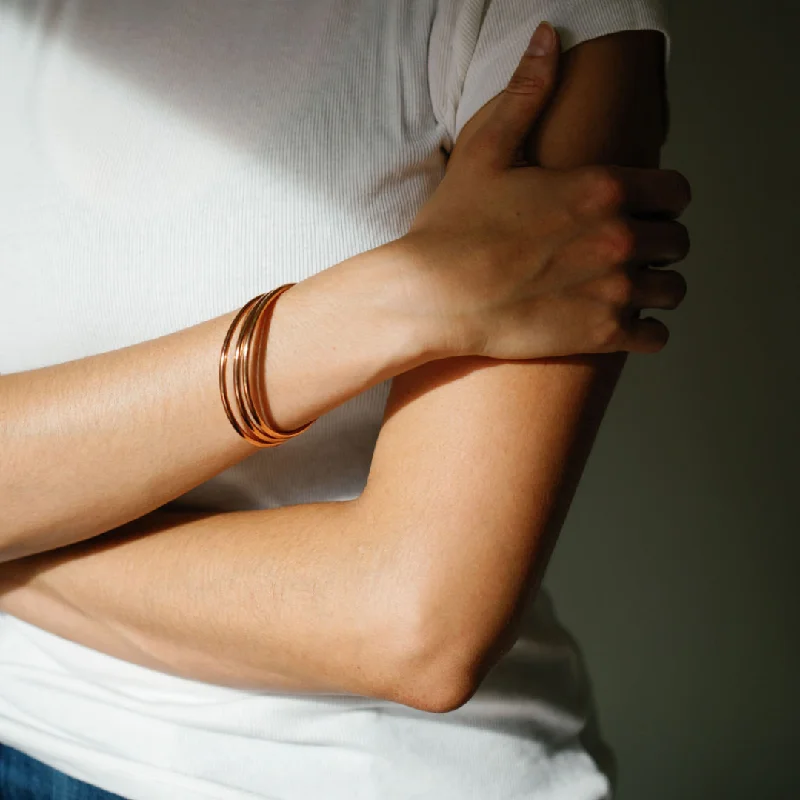 Leather - Wrapped Bangles with Studded Details for a Rock - Chic VibeRose Gold Luxe Bangle Bracelets