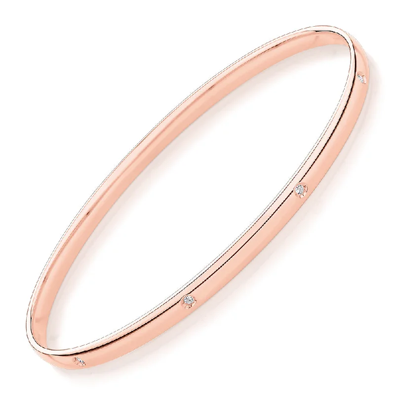 Boho - Style Bangle Bracelets with Feather and Bead EmbellishmentsOval bangle with diamond simulants in 10 carat rose gold