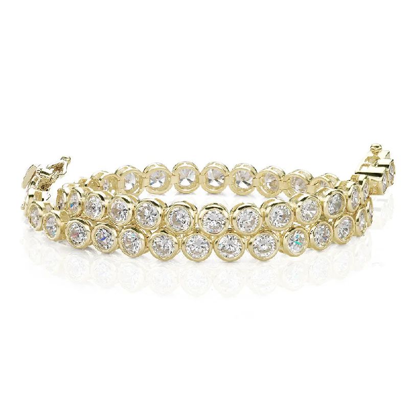 Clear Crystal - Embellished Bangles for a Sparkling and Elegant AppearanceRound Brilliant tennis bracelet with 5.28 carats* of diamond simulants in 10 carat yellow gold