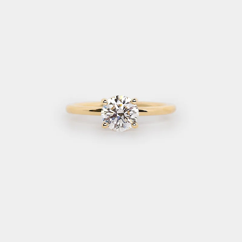 Cathedral - Style Engagement Rings with a Raised Center Stone and Intricate MetalworkRitual solitaire plain band ring - round natural white diamond